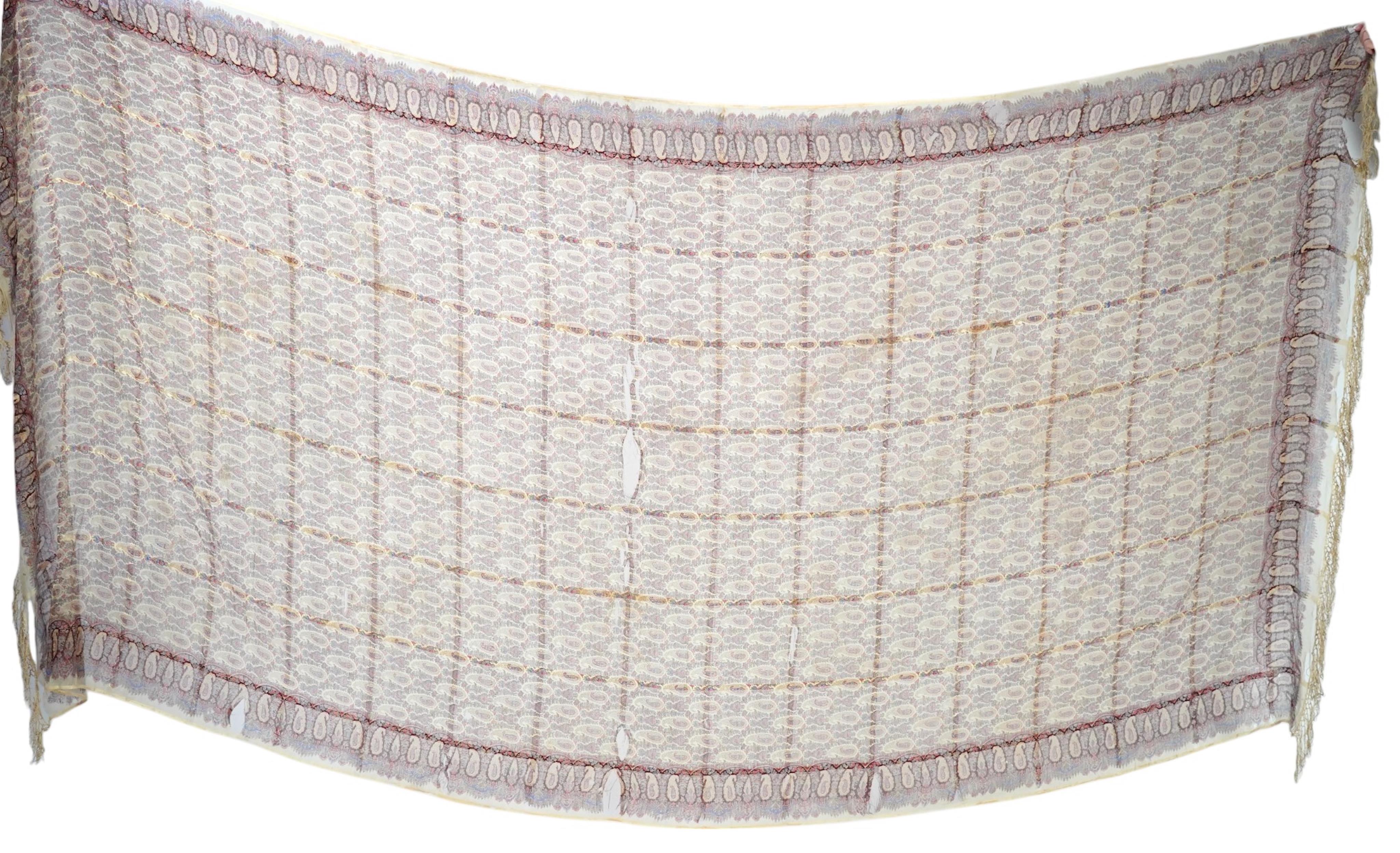 A 19th century fine woven wool and silk, lady’s printed paisley summer shawl. 160cm x 320cm. Condition - fragile in many parts, maybe a useful film prop.